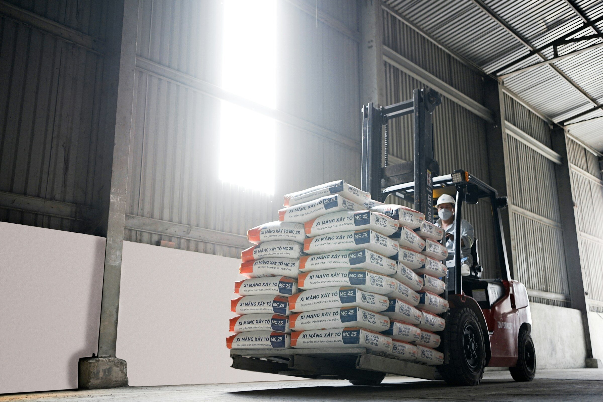 A forklift carrying a stack of boxes