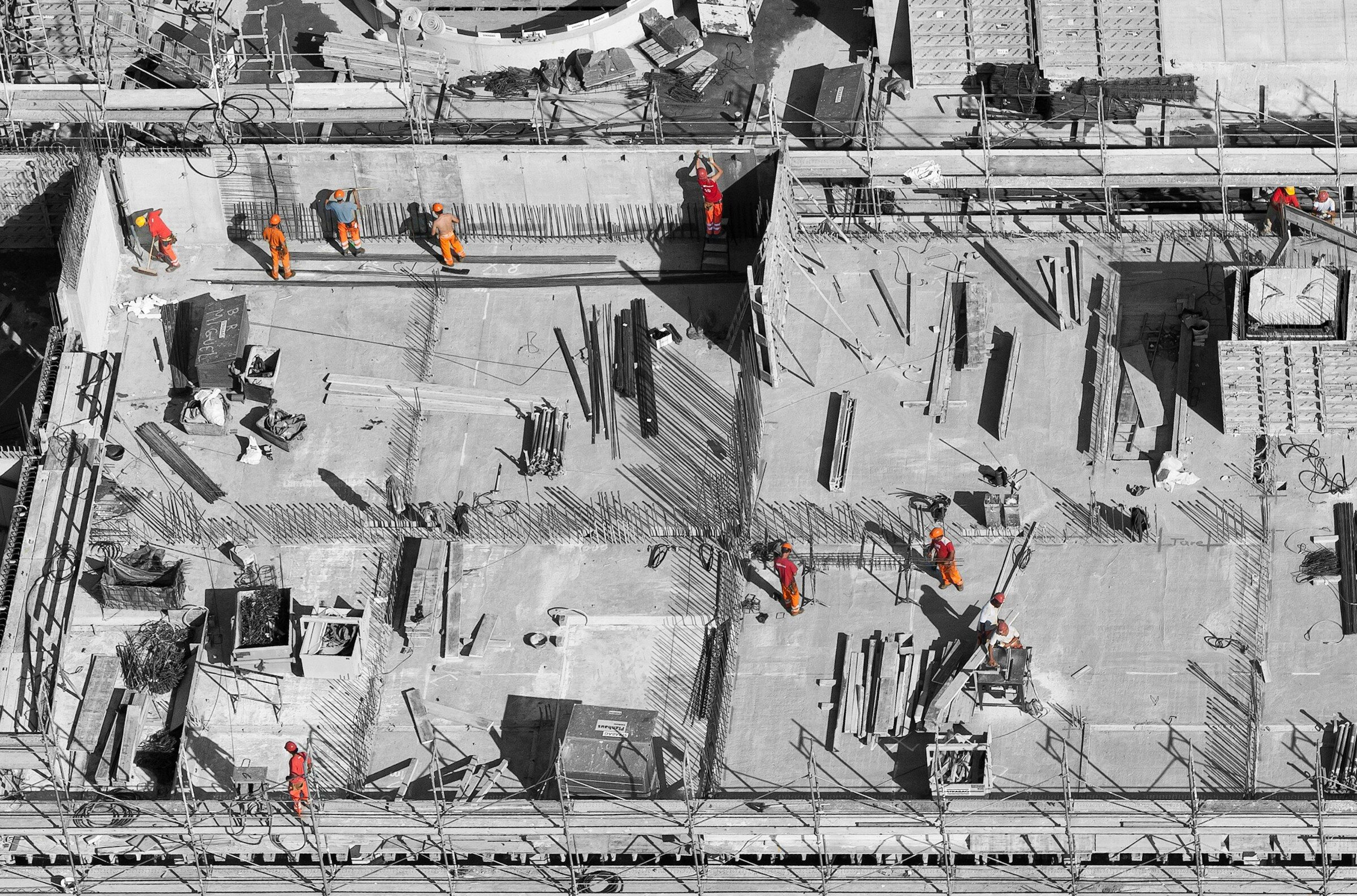 Site workers in high-visibility clothing seen from above