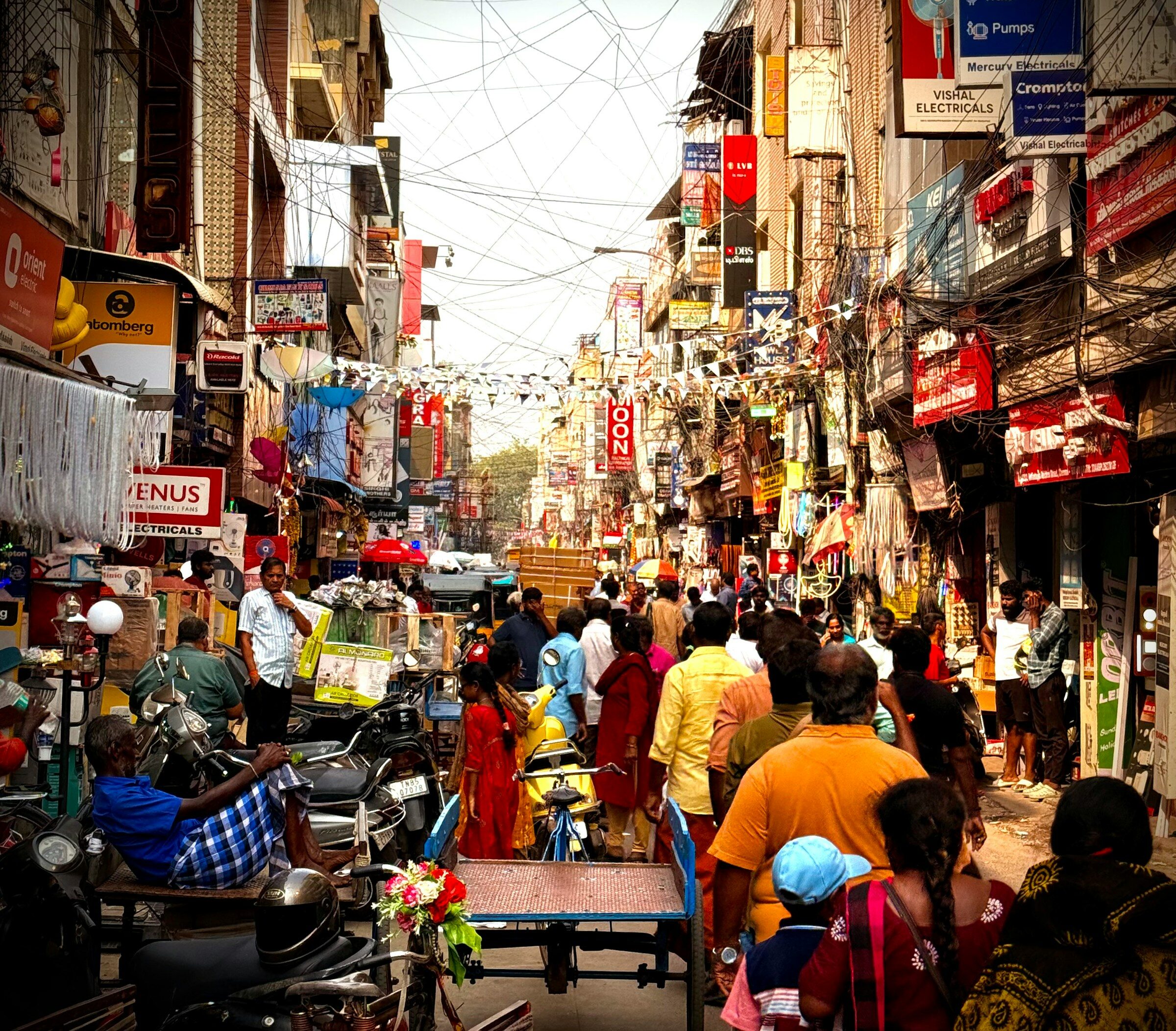 A busy Indian street lined with small shops