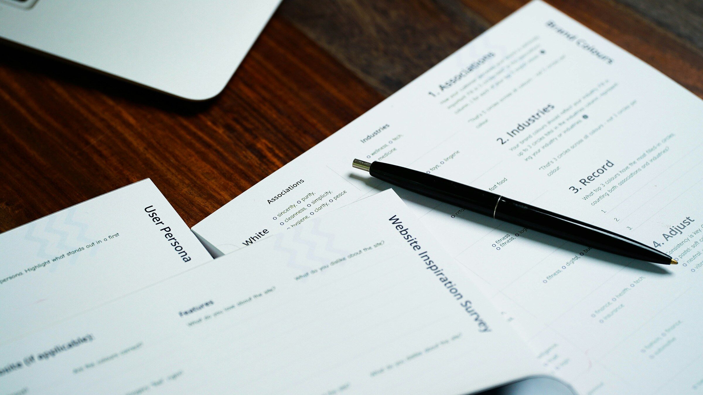 A pen on a pile of papers