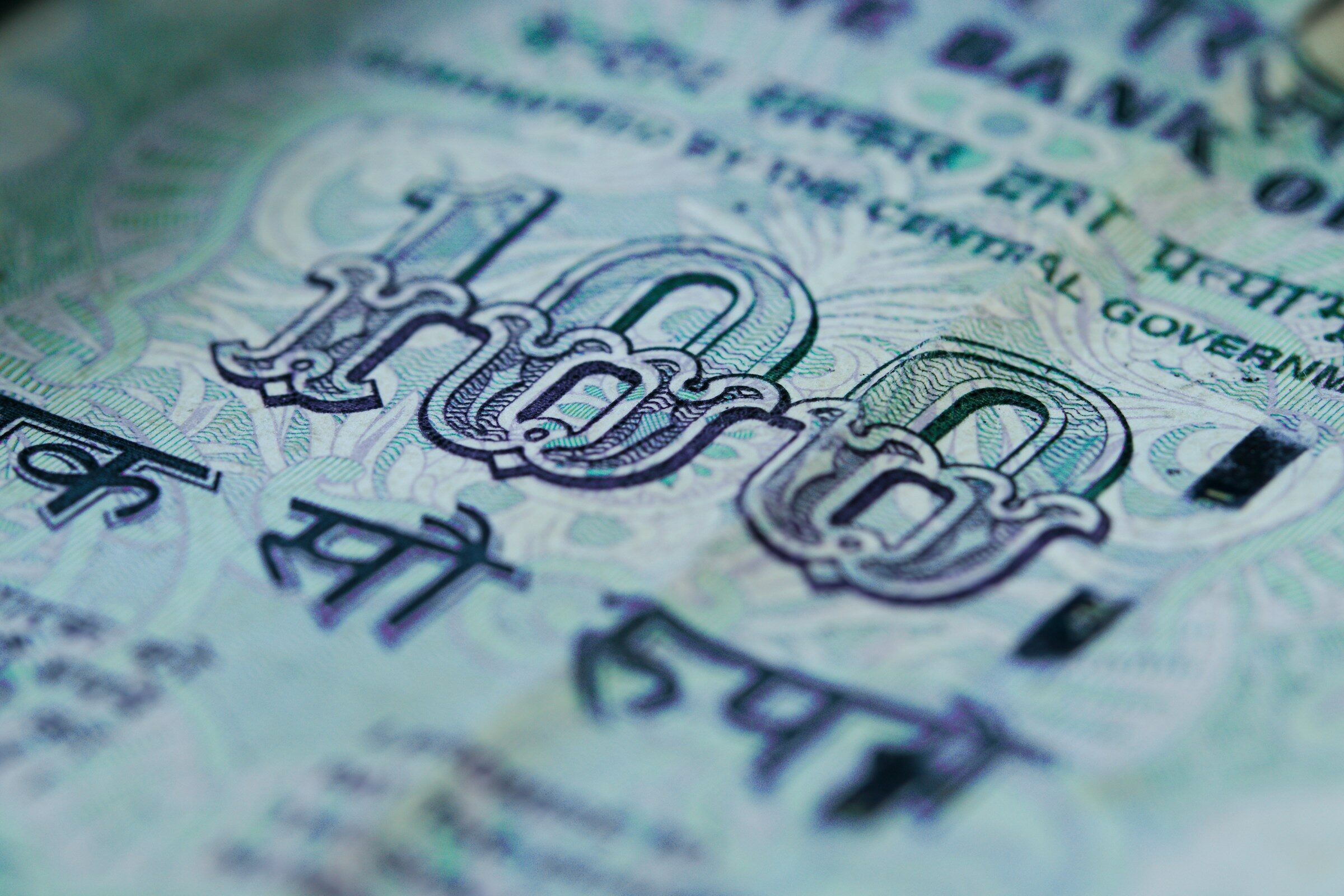 A hundred-rupee note, close up