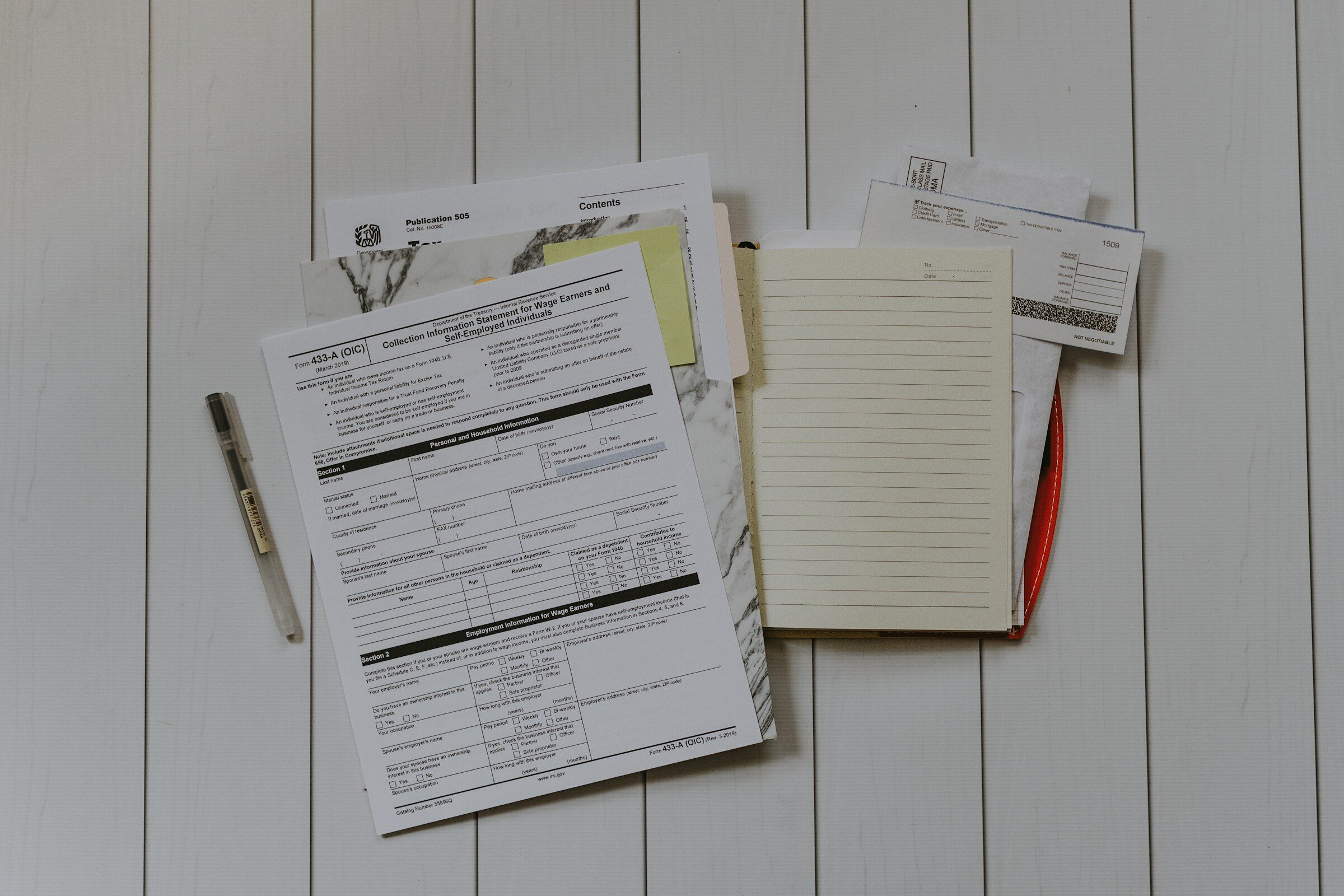 A stack of papers, flat lay