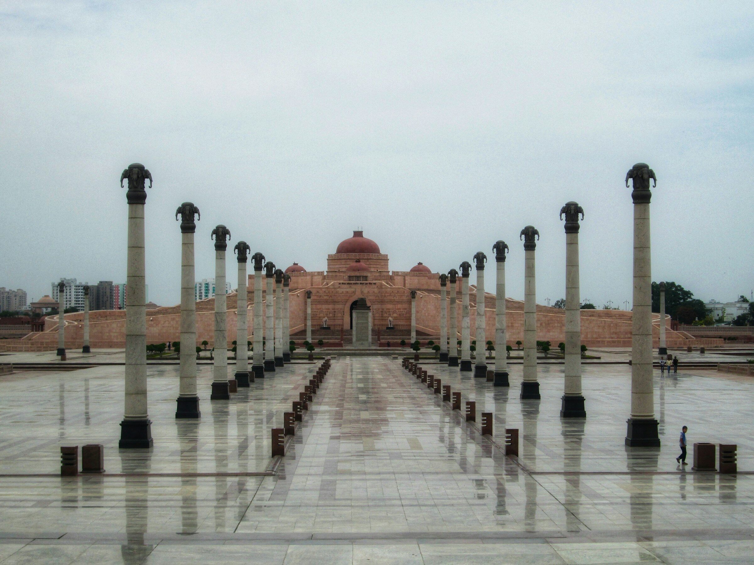 A columned building in Lucknow with a clock tower