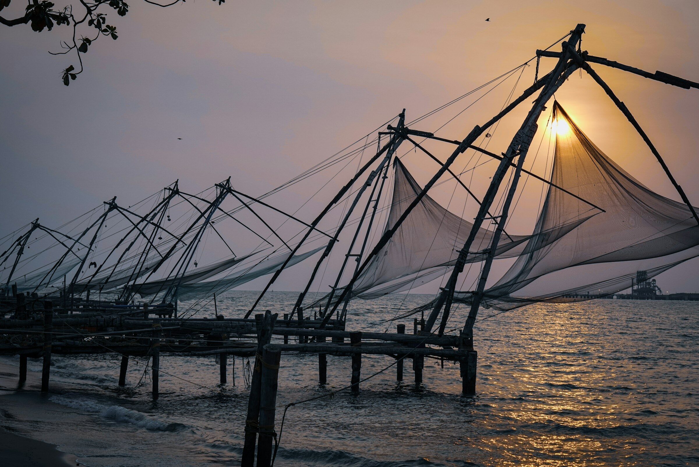 A row of Chinese fishing nets over the water at Kochi