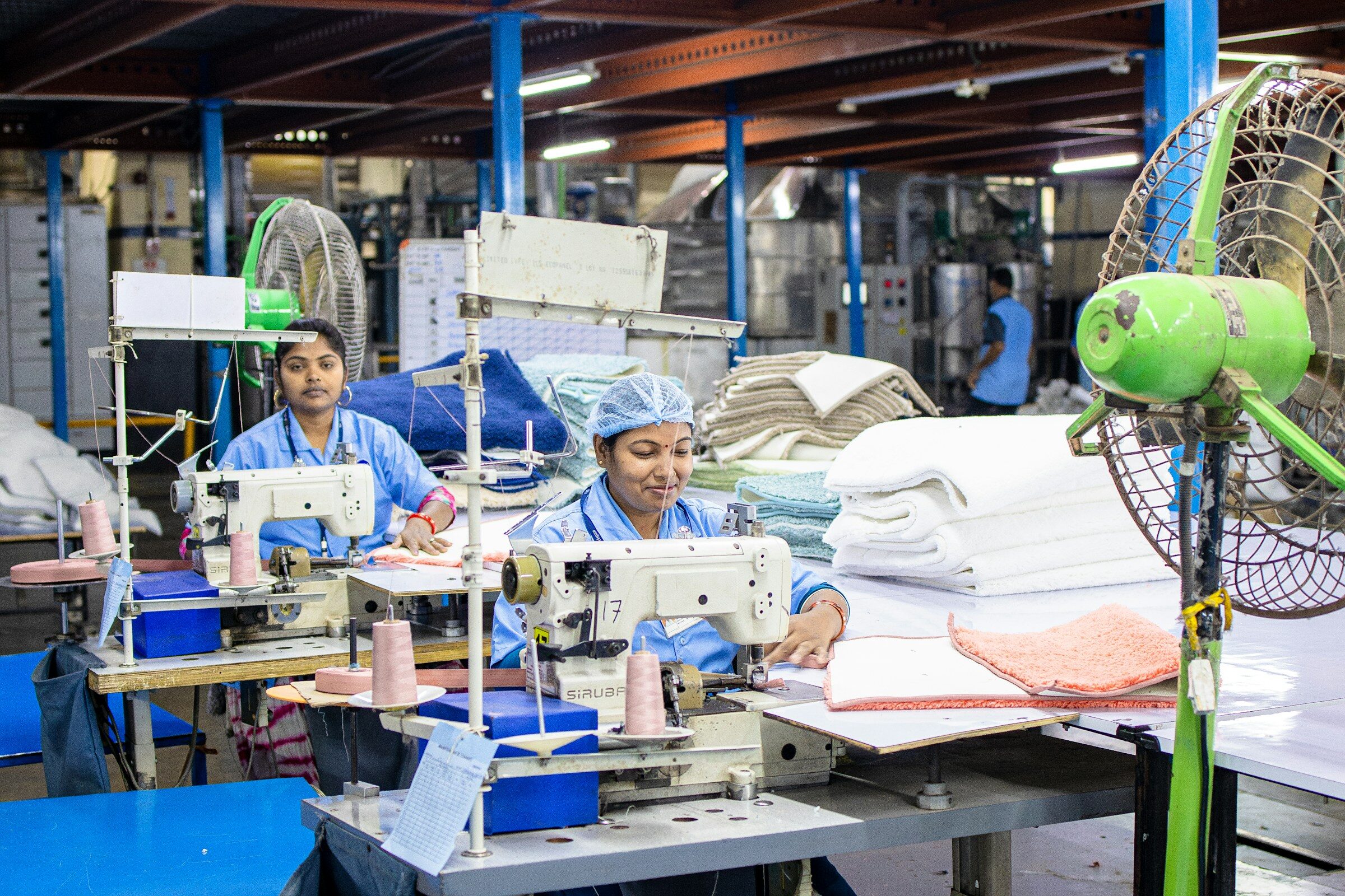 Workers at a line of sewing machines
