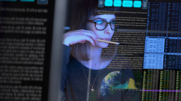 TechAuditPros analyst reviewing a wall of search-performance data during an SEO audit
