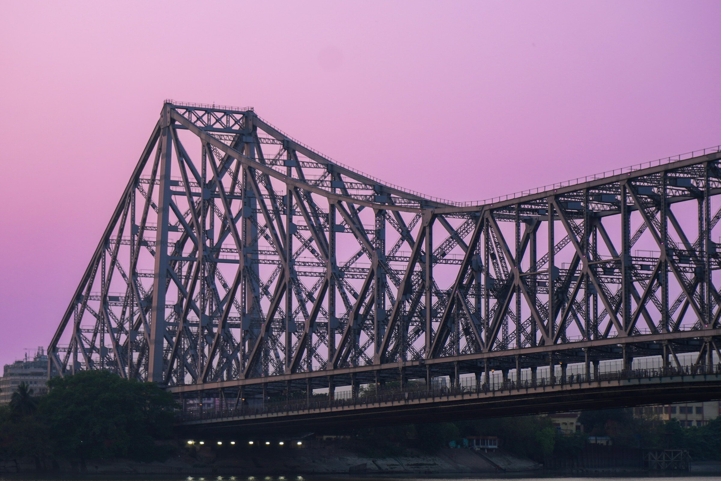 Howrah Bridge against a purple evening sky