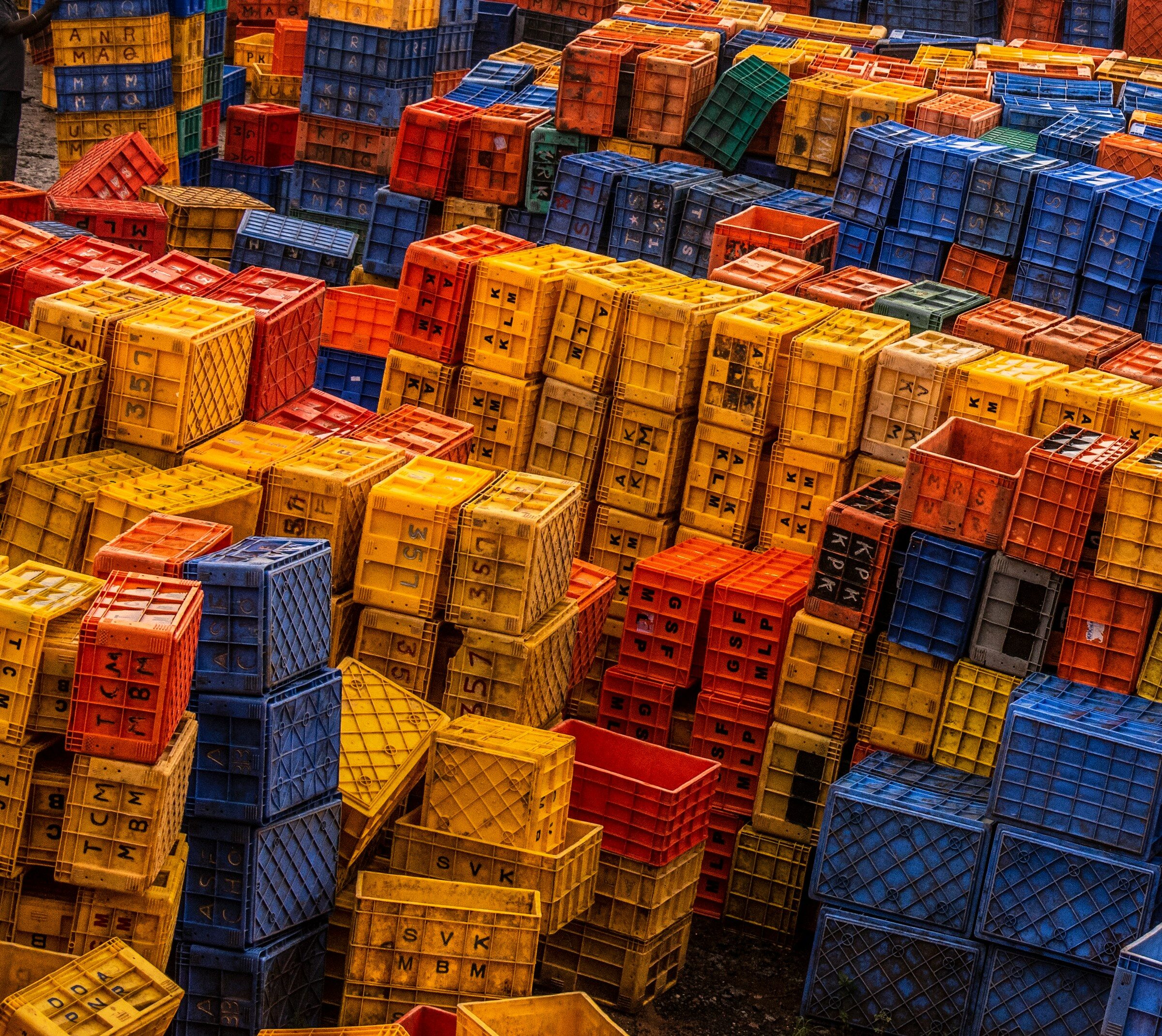 Plastic crates stacked high in a Mumbai wholesale yard