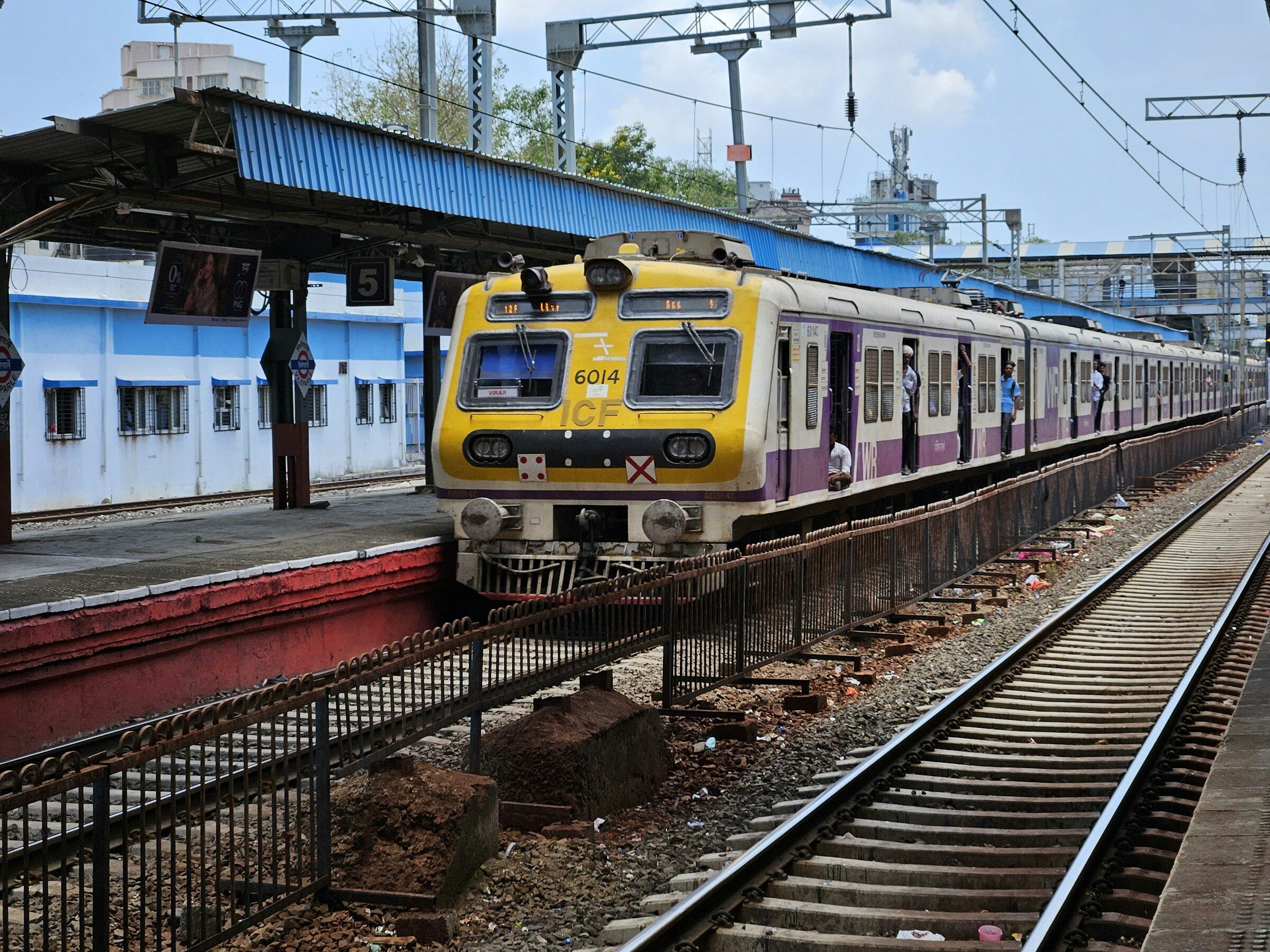 A Mumbai local train pulling into a platform