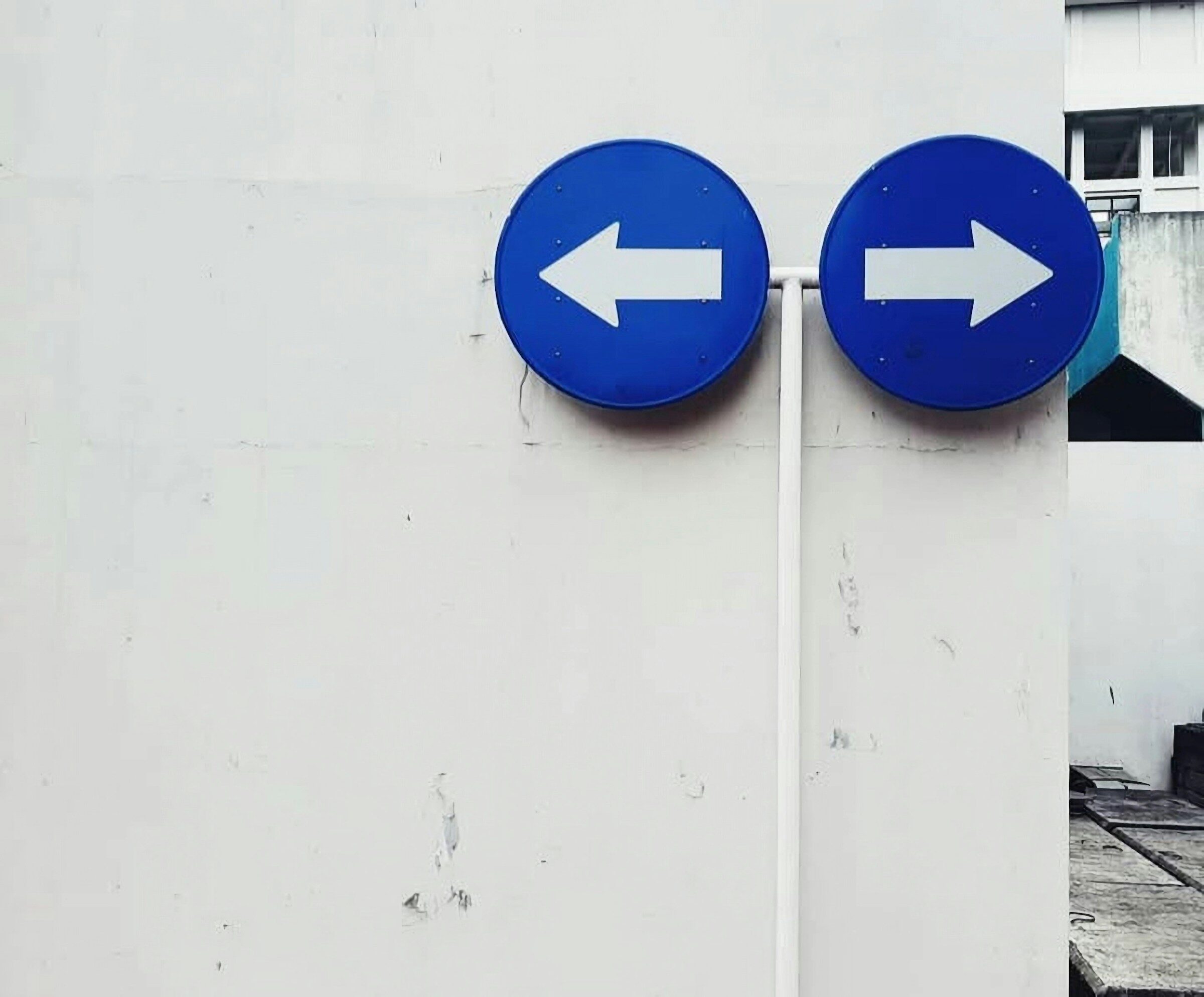 Two signs pointing in opposite directions