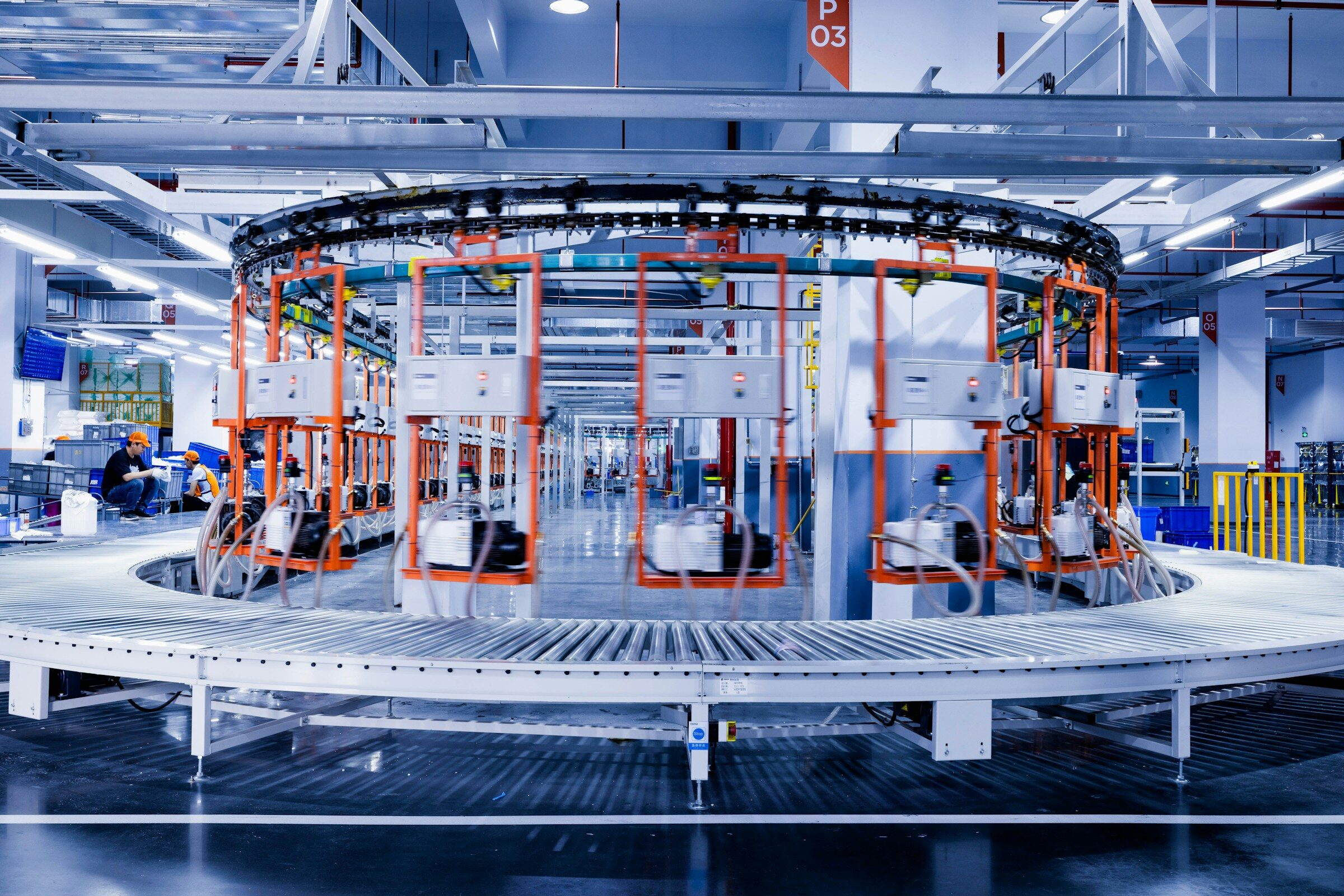 Engineers working together on a production machine