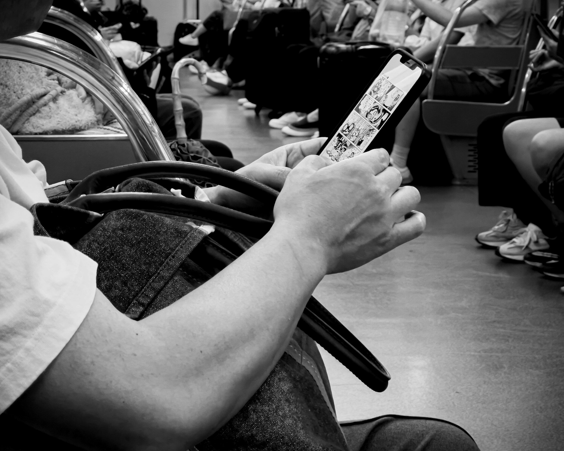 Passenger using a smartphone on public transport