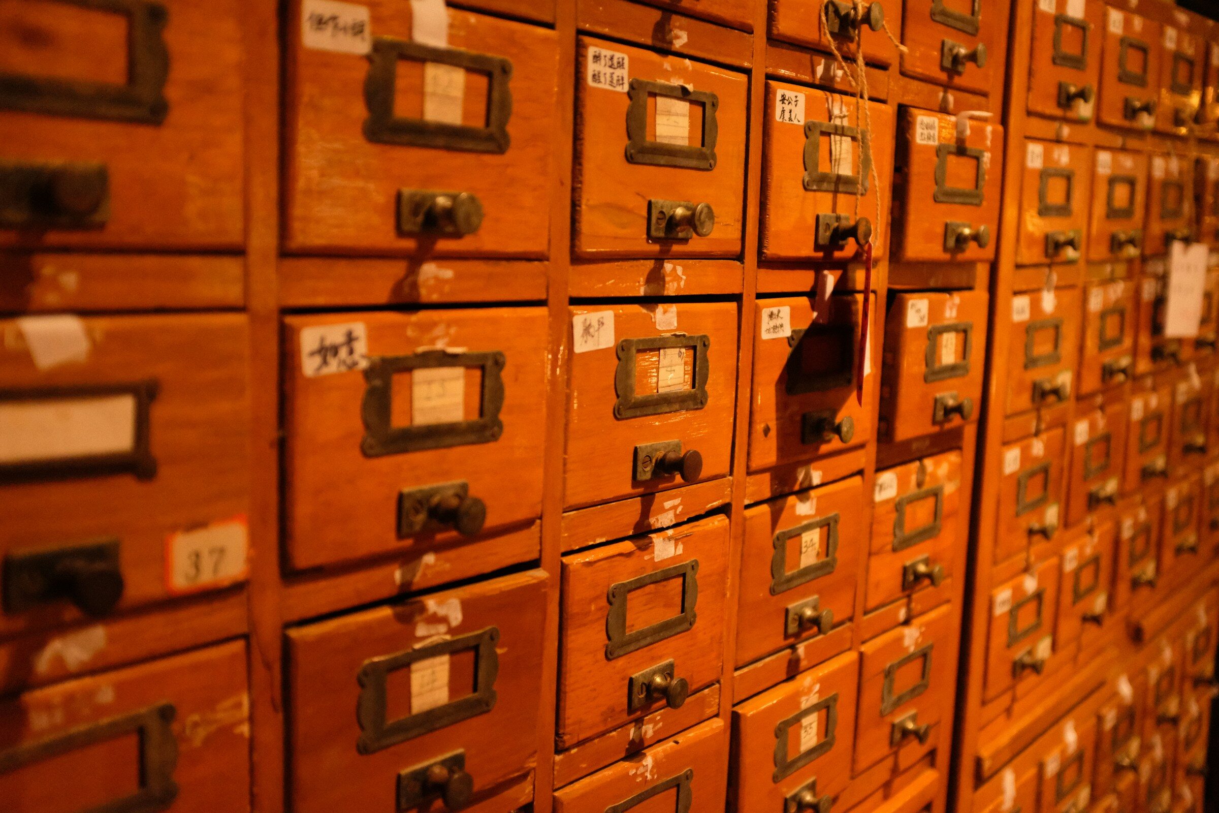A wall of labelled drawers where everything has one obvious place